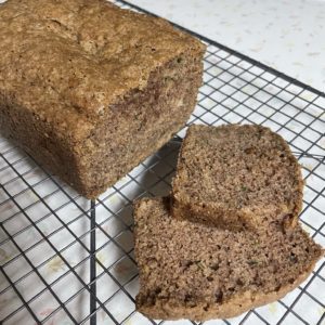 loaf of zuchini bread and two slices