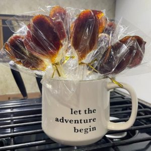 honey spoons in a cup