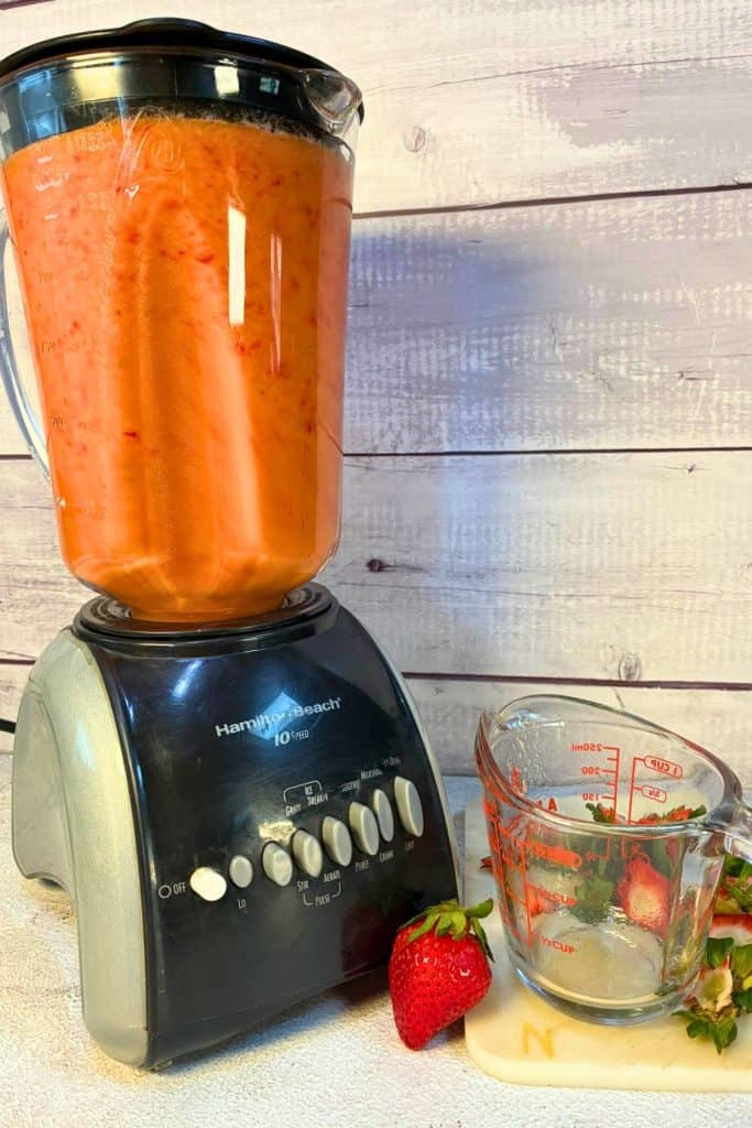 blending strawberry fruit popsicles in blender