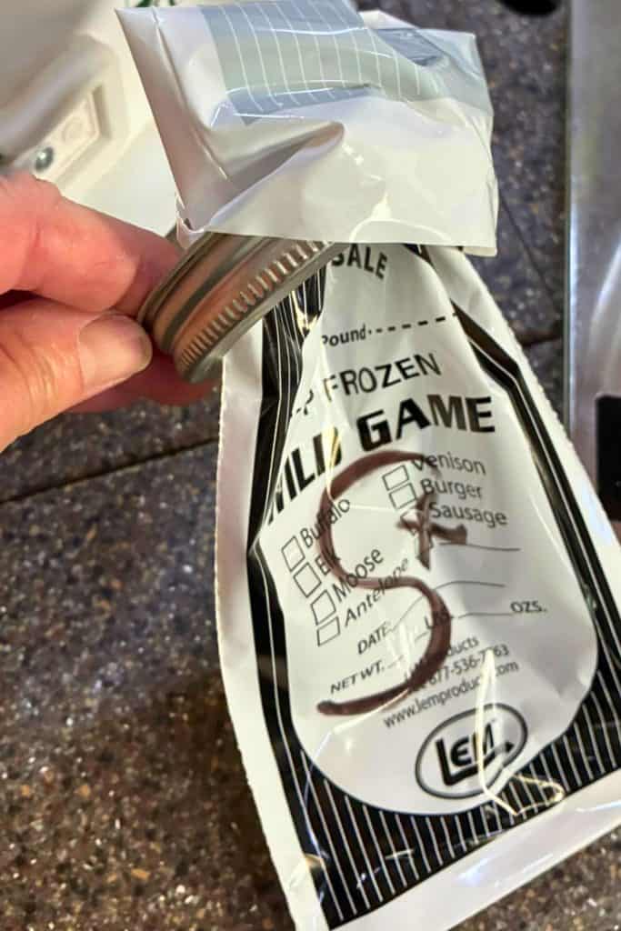 canning ring keeps the game bag open