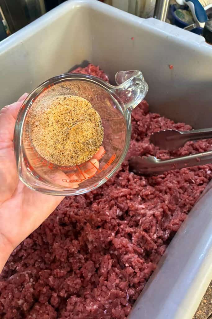 seasoning blend ready to pour over ground pork
