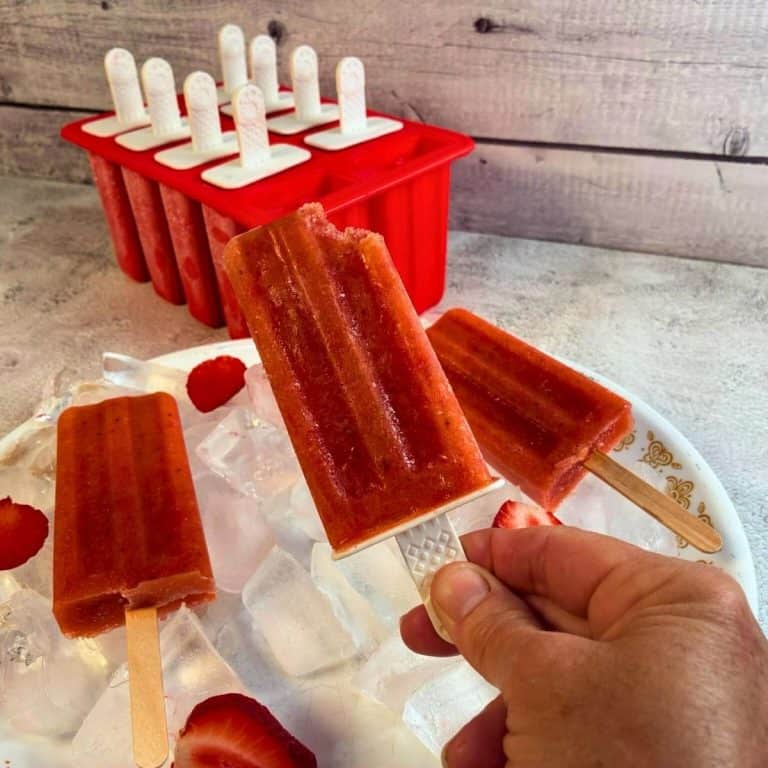 strawberry fruit popsciles and mold in the background