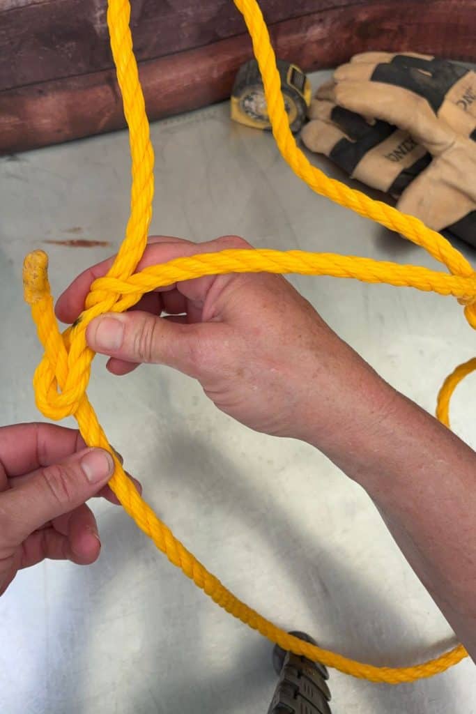 feed lead rope end through the first loop we made