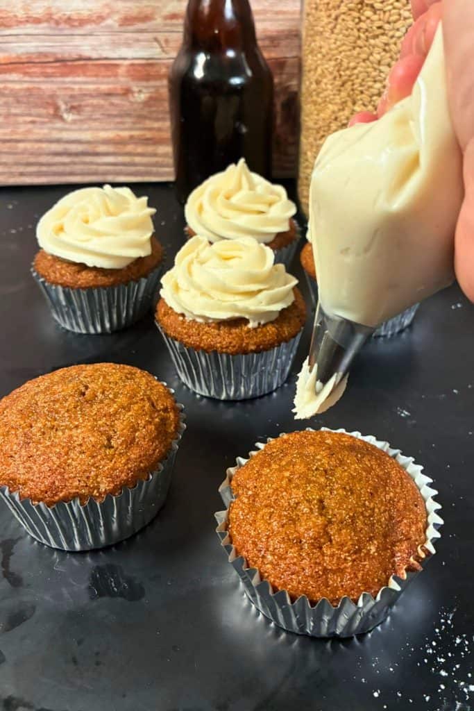 frosting the pumpkin bar cupcakes