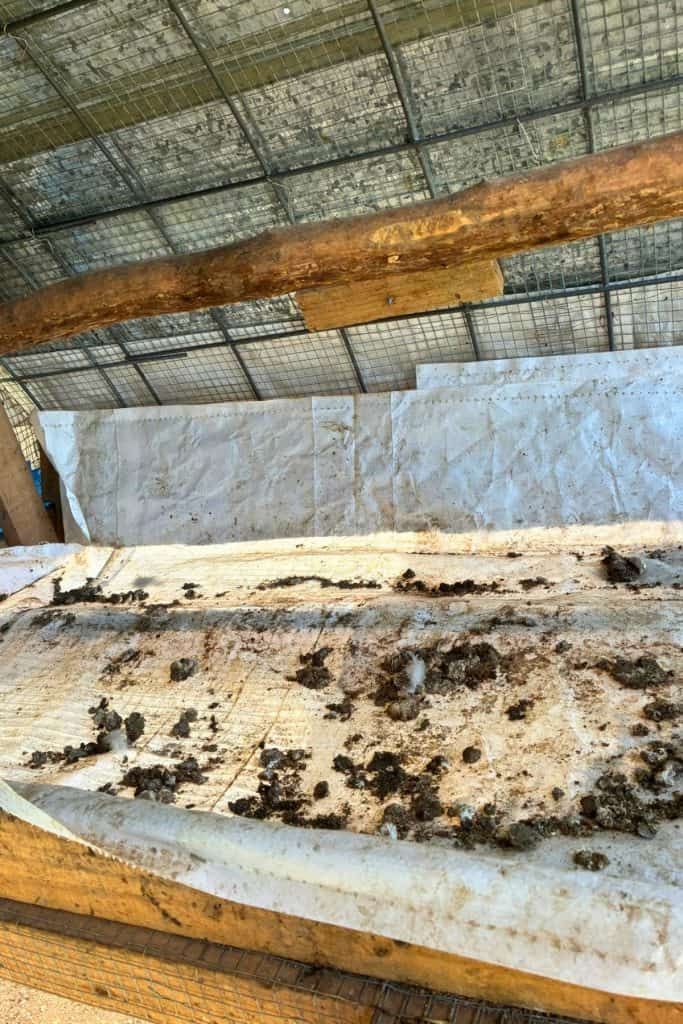 wire dropping board covered with grain sack