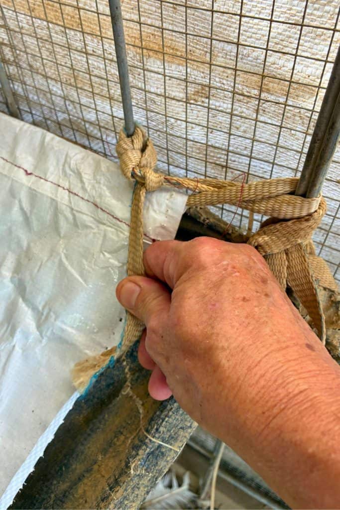 use cordage to attach poop hammock to wire